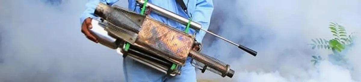 Fumigation technician using a fogger for deep pest treatment in Irvine, CA